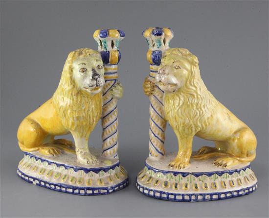 A pair of Italian maiolica lion candlesticks, 19th century, height 24cm